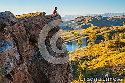 The man sitting on edge on grief Stock Photo