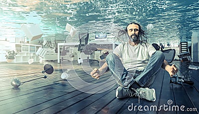 Man sitting underwater who relaxes in a yoga position Stock Photo