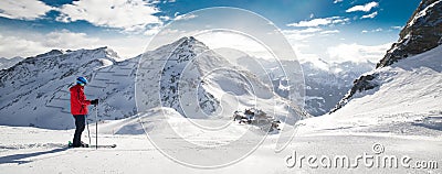 Man skiing on the prepared slope with fresh new powder snow in A Stock Photo