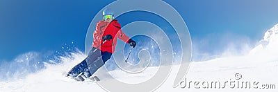 Man skiing on the prepared slope with fresh new powder snow in A Stock Photo