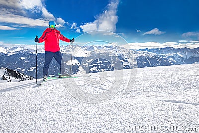 Man skiing on the prepared slope with fresh new powder snow in Alps Stock Photo