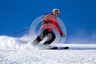 Man skiing on ski slope Stock Photo