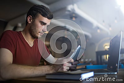 Man skilled freelance social media content writer using applications on touch pad gadget Stock Photo