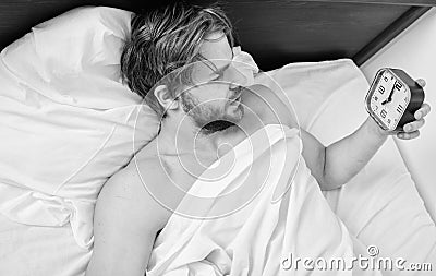 Man sleepy drowsy unshaven bearded face covered with blanket having rest. Stick sleep schedule same bedtime and wake up Stock Photo