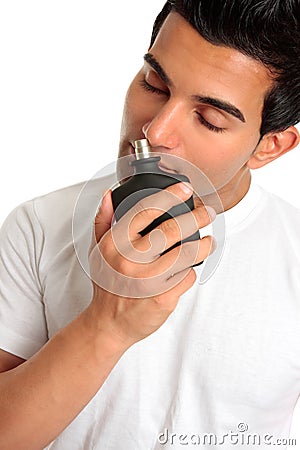 Man smelling aftershave cologne Stock Photo