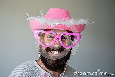 Man smile face and funny glasses feeling happy. Handsome smiling cowboy. Positive human facial expressions and emotions. Stock Photo
