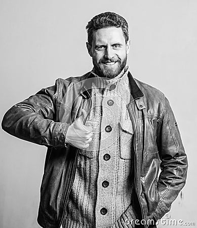 Man smile with thumbs up. Happy man wear leather jacket. Recommendation concept. Satisfied bearded guy. Excellent Stock Photo