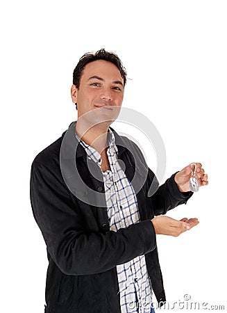 Man smiling and holding miniature tools for fun Stock Photo