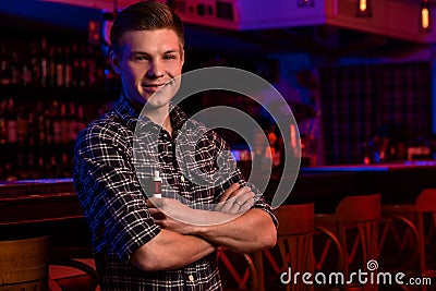 The man smoke an electronic cigarette at the vape shop. Stock Photo