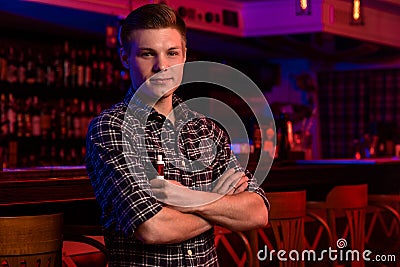 The man smoke an electronic cigarette at the vape shop. Stock Photo