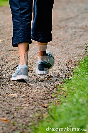 Man with sneakers running on a path, helathy activity to make exercice Stock Photo