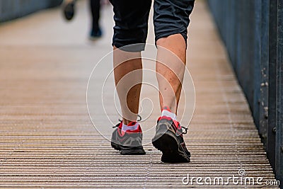 Man with sneakers running on a path, helathy activity to make exercice Stock Photo