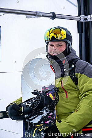 man snowboarder portrait in ski lift cabin Stock Photo