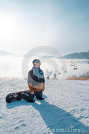 man snowboarder portrait at ski slope Stock Photo