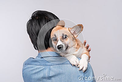 A man snuggling and hugging his dog, close friendship loving in Stock Photo