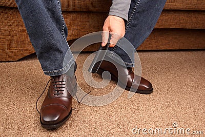 Man with a spatula shoes classic brown shoes Stock Photo
