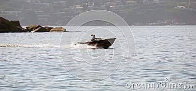 Man in a speed boat over the sea Editorial Stock Photo