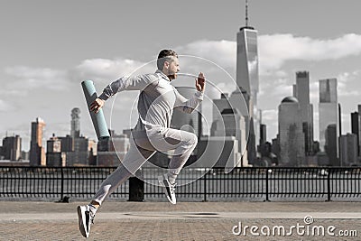 Man in sports suit training jogging. Running man in Manhattan. Morning sport workout jogger run in New York. Jogger run Stock Photo