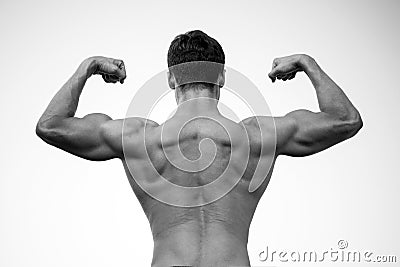 Man or sportsman flexing arms with fists, back view Stock Photo