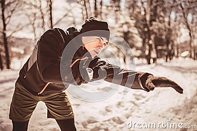 Man Taking Break From Running in Extreme Snow Conditions Stock Photo