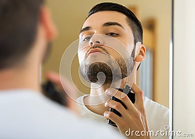 Man spraying fragrance perfume Stock Photo