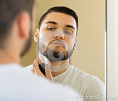 Man spraying fragrance perfume Stock Photo