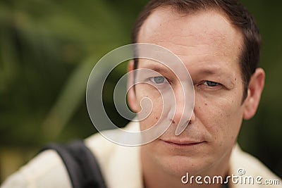 Man squinting his eyes Stock Photo