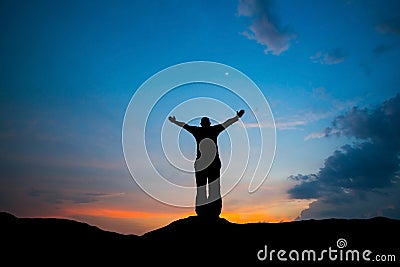 Man stand at sunset hope for success Stock Photo