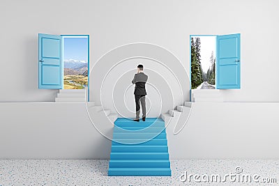 Man standing on abstract staircase with two open doors in concrete interior. Success, way and opportunity concept Stock Photo