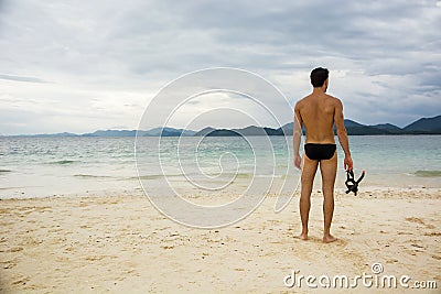 Man standing on beach Stock Photo