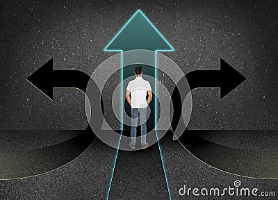 Man standing at crossroads. Choice between different ways Stock Photo