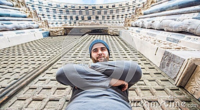 Man standing in front of San Lorenzo cathedral in Genoa, Italy - looking at the camera Stock Photo