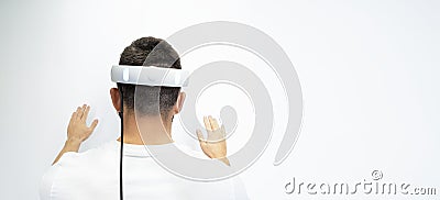 Man is standing with his back in virtual glasses on a white background Stock Photo