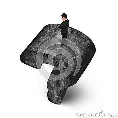 Man standing on huge 3D concrete question mark white background Stock Photo