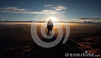 Man standing on mountain peak, admiring majestic sunset, achieving adventure generated by AI Stock Photo
