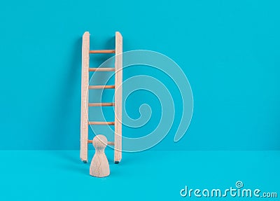 Man is standing next to a ladder, climbing up in career, having a goal, brainstorming for ideas, success strategy, challenge Stock Photo