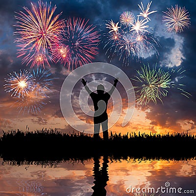 A man looks holiday fireworks Stock Photo