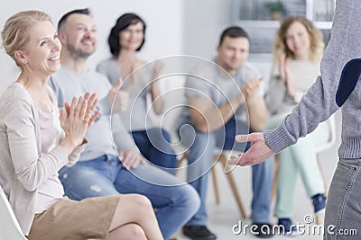 Man standing in support group Stock Photo