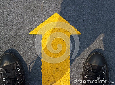 Man standing with yellow arrow move forward to future Stock Photo