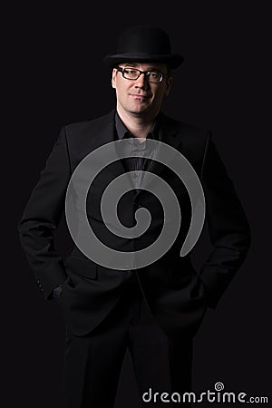 Man stands with bowler hat. Stock Photo