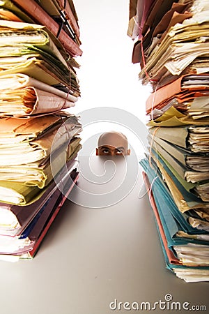 Man stares at files Stock Photo