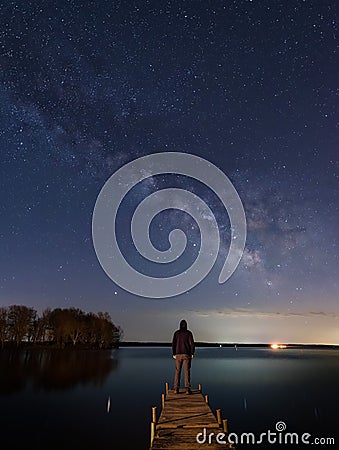 Man and the Stars in midwestern Ohio at the lake Stock Photo