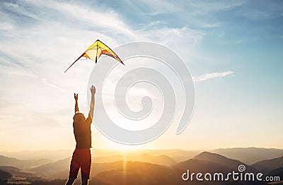 Man start to fly a kite in the sky Stock Photo