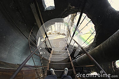 Man staying on destroyed water tower. Stock Photo