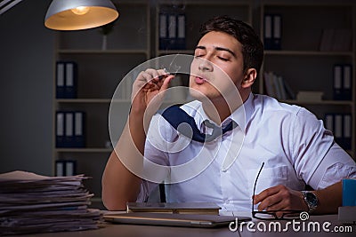 The man staying late at night and smoking marijuana Stock Photo