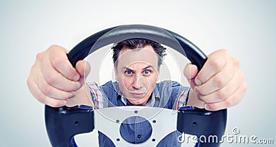 Man with a steering wheel, front view. Driver car concept Stock Photo