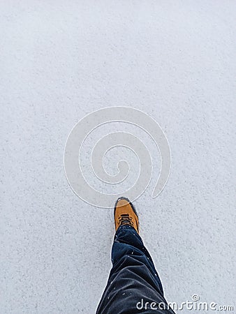 Man step forward on the white snowy ground Stock Photo