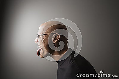 Man sticking out tongue. Stock Photo