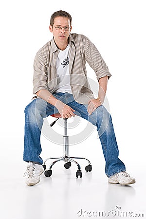 Man on stool Stock Photo