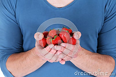 Man with strawberries Stock Photo